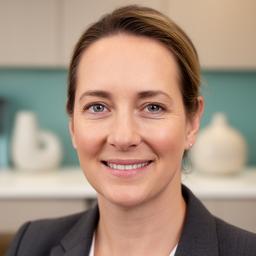 Sarah L., Operations Director headshot with a friendly office background